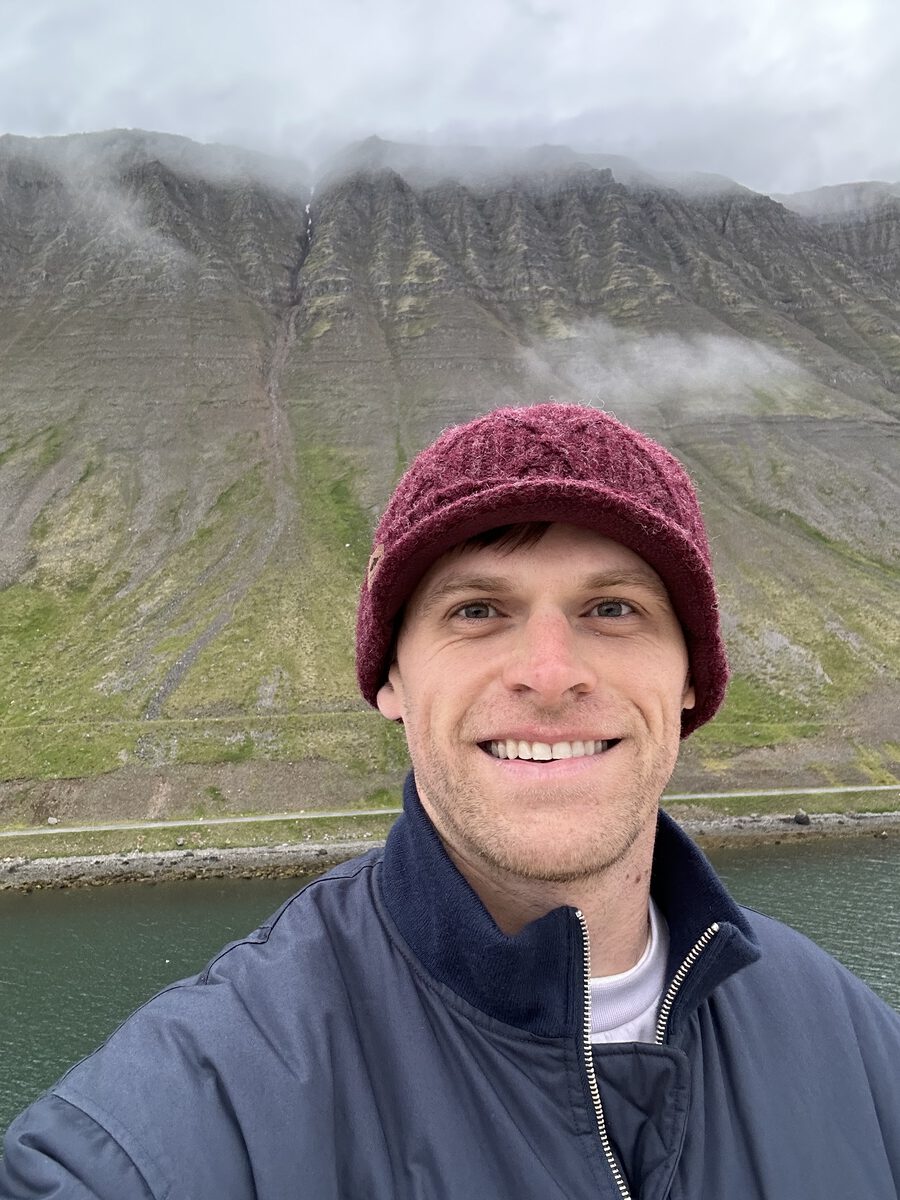 Lyle Mills, founder of Rubato Audio, smiling in front of a misty mountainside.